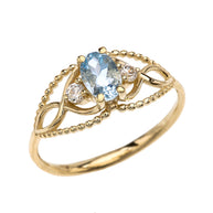 Elegant Beaded Solitaire Ring With Aquamarine Centerstone and White Topaz in Yellow Gold