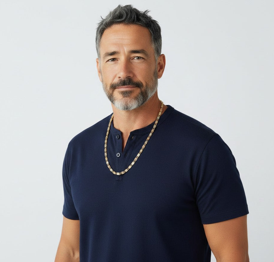 A man wearing a TYS Jewelers 10K gold trio color Valentino chain against a plain white background.