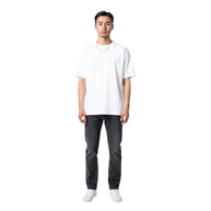 TYS Jewelers 10K yellow gold box chain worn by a man in a white t-shirt and dark jeans against a white background.