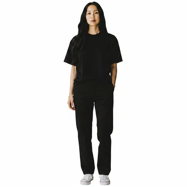 TYS Jewelers 10K yellow gold curb Cuban bracelet worn by a woman in a black t-shirt and trousers