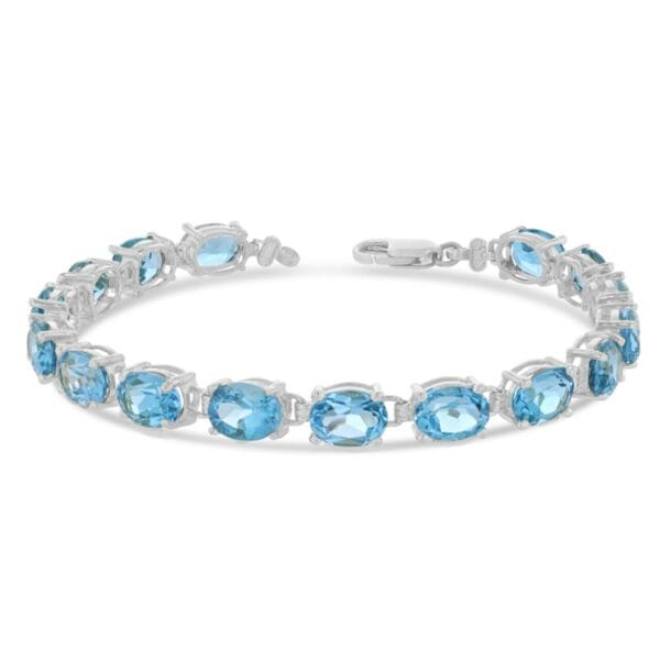 Oval Genuine Blue Topaz (8 X 6) Tennis Bracelet In White Gold